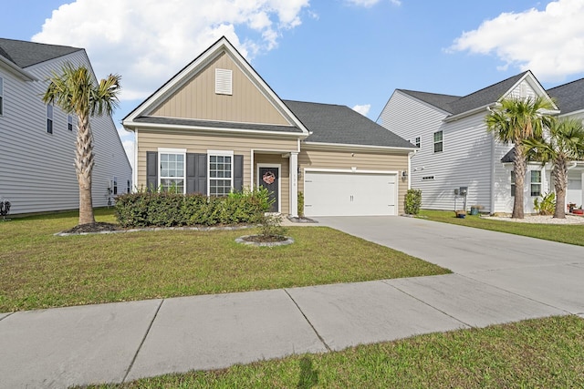 view of front of property featuring a front yard and a garage