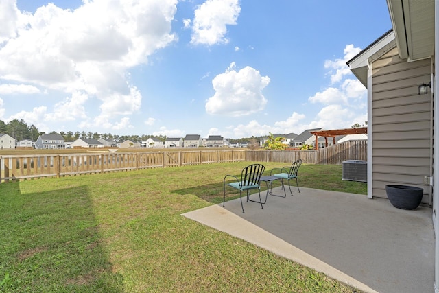 view of yard with a patio area and central AC unit