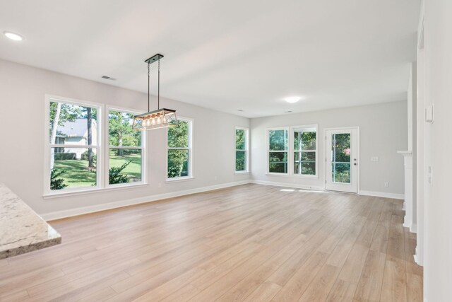 unfurnished living room featuring light hardwood / wood-style floors