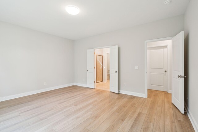 unfurnished bedroom with light wood-type flooring