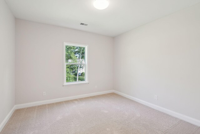 unfurnished room with carpet floors