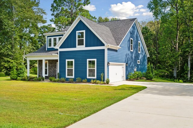 view of front of home with a garage and a front yard