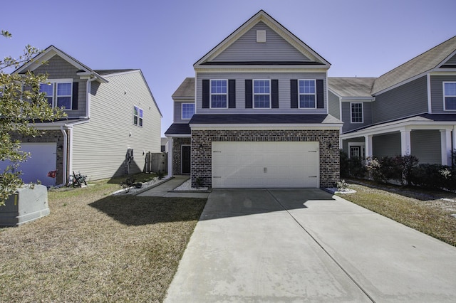 traditional home featuring a garage, brick siding, and concrete driveway