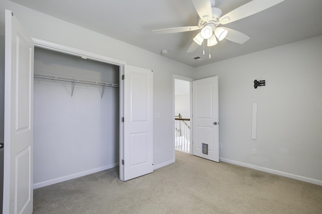 unfurnished bedroom featuring visible vents, baseboards, a closet, and carpet flooring