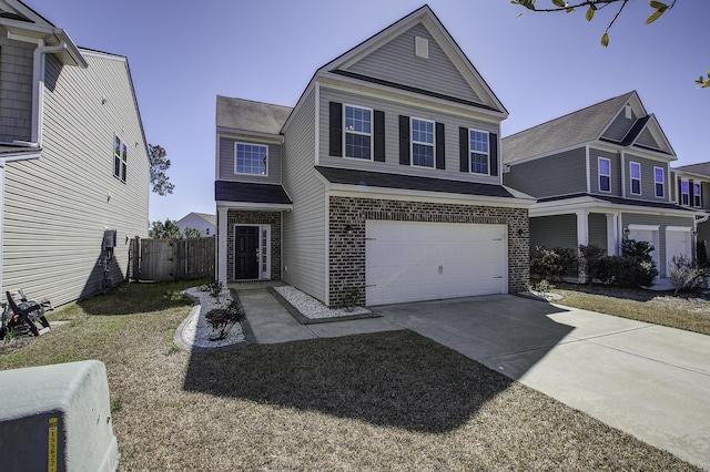 traditional home with concrete driveway, an attached garage, fence, and brick siding