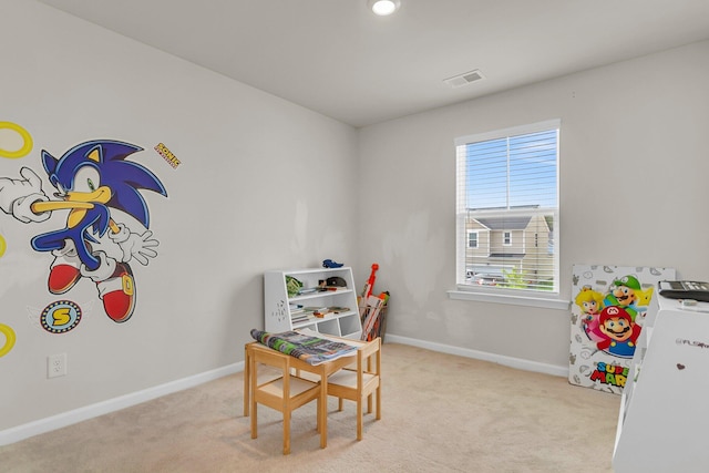 recreation room with light carpet, visible vents, and baseboards