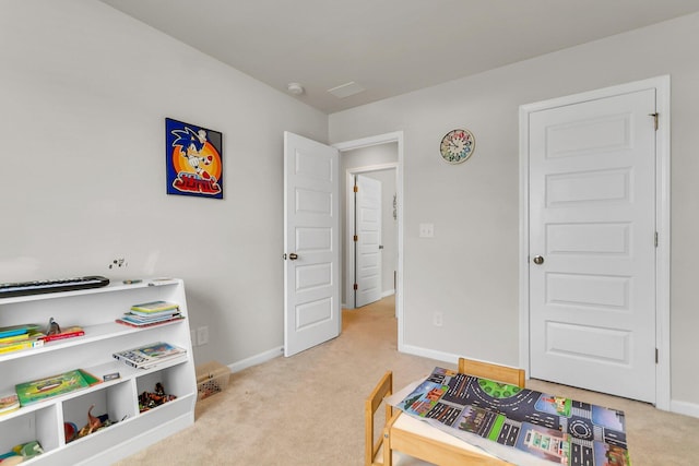 recreation room featuring baseboards and carpet floors