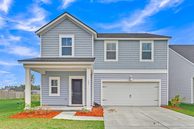 traditional home featuring a front yard, concrete driveway, a garage, and roof with shingles