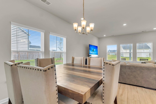 dining area with recessed lighting, visible vents, light wood-style floors, and a chandelier