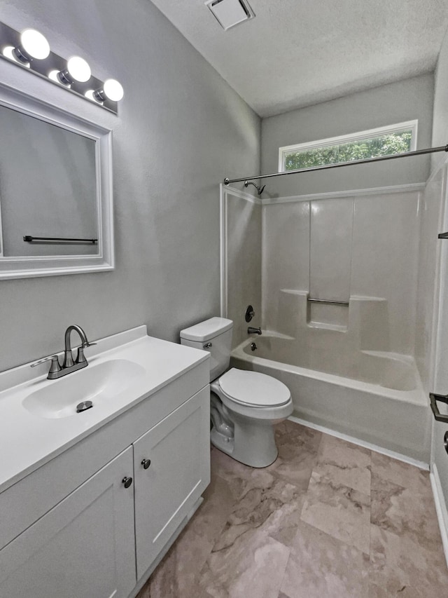 full bathroom with toilet, vanity, and shower / bathtub combination