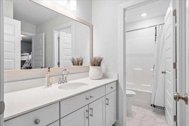 full bathroom with vanity, shower / tub combo with curtain, and toilet