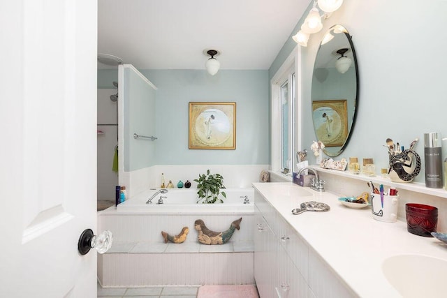 bathroom with a garden tub and double vanity