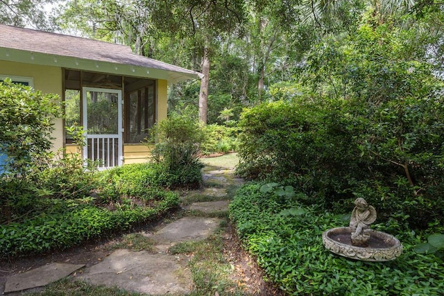 view of yard featuring a sunroom