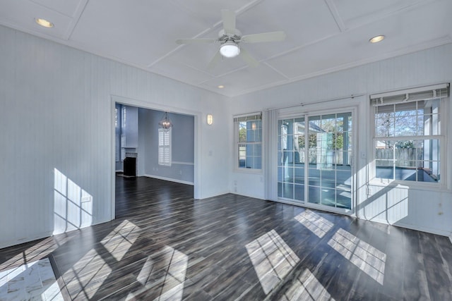 empty room with dark wood-type flooring and ceiling fan