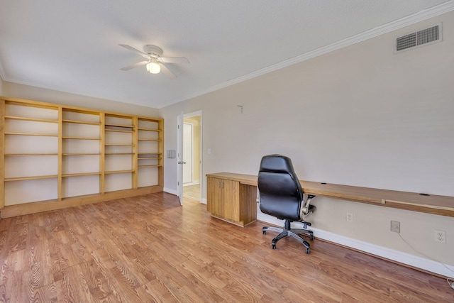 unfurnished office with crown molding, ceiling fan, and light hardwood / wood-style floors