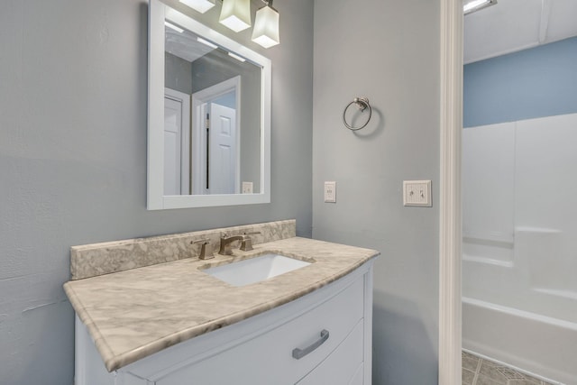 bathroom featuring vanity and a tub to relax in