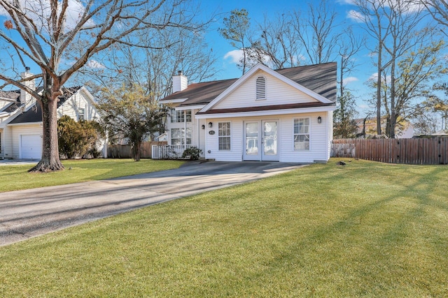 view of front facade with a garage and a front yard