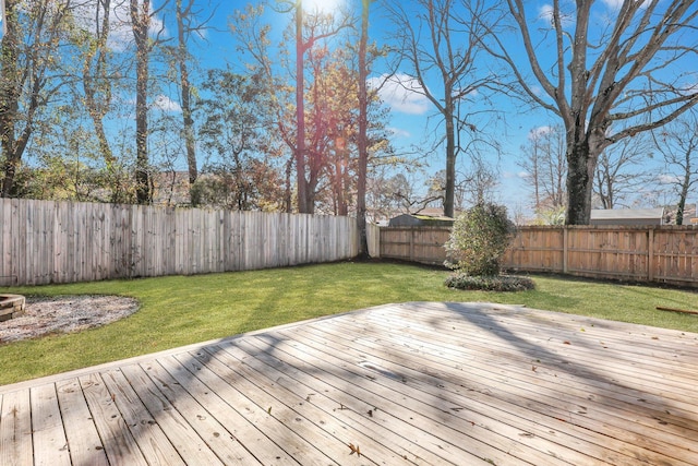 wooden terrace featuring a yard