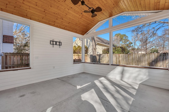 unfurnished sunroom featuring wood ceiling, ceiling fan, and lofted ceiling