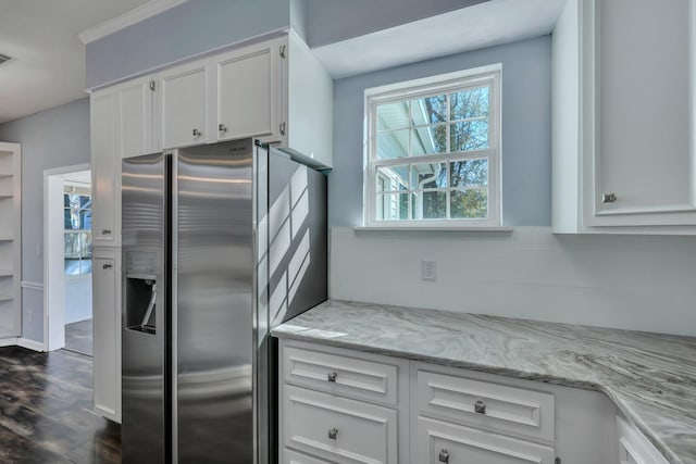 kitchen featuring dark hardwood / wood-style floors, light stone countertops, stainless steel fridge with ice dispenser, and white cabinets