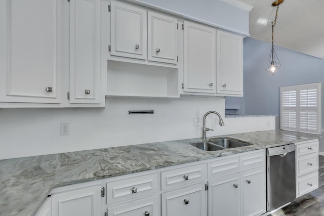 kitchen with hanging light fixtures, sink, stainless steel dishwasher, and white cabinets