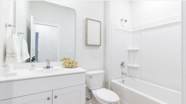 full bathroom featuring shower / bathing tub combination, vanity, and toilet