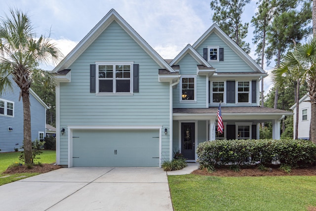 view of front of house with a front lawn and a garage