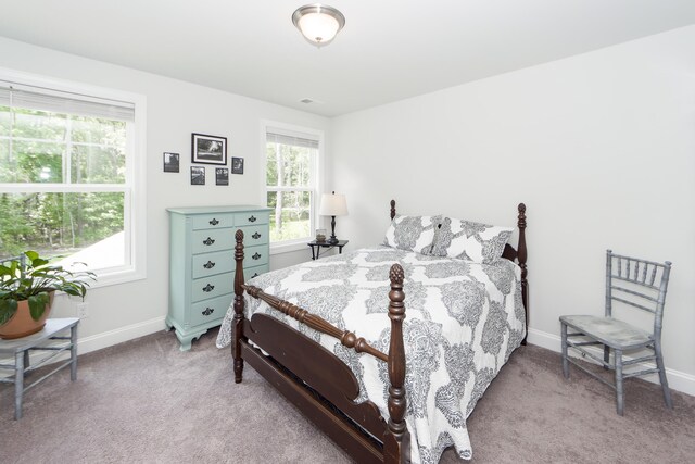 bedroom with light carpet