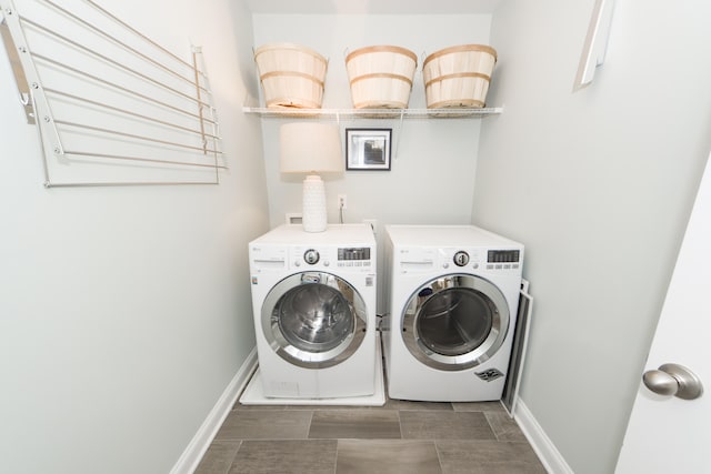 laundry area featuring washing machine and clothes dryer