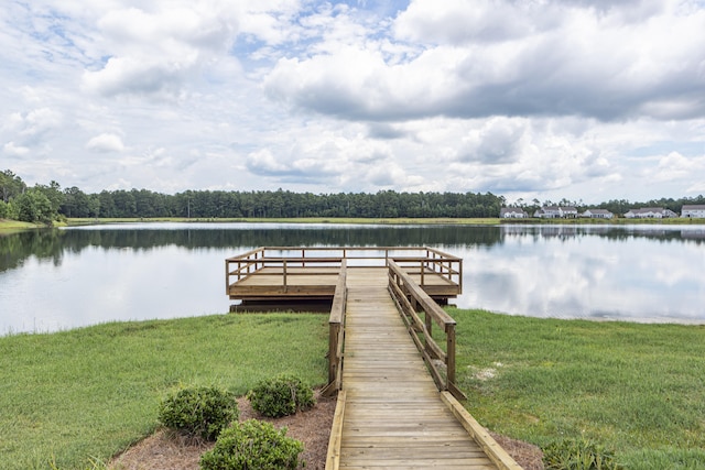 dock area featuring a water view and a yard