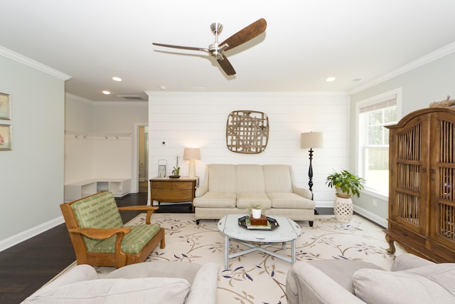 living room with ceiling fan, hardwood / wood-style floors, and ornamental molding