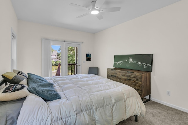 carpeted bedroom featuring access to exterior, baseboards, and a ceiling fan