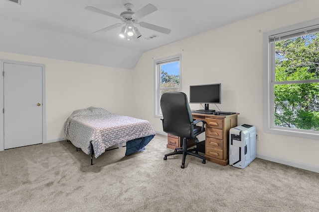 carpeted bedroom with multiple windows, a desk, baseboards, and lofted ceiling