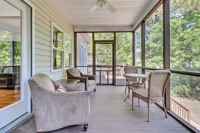 sunroom / solarium with ceiling fan