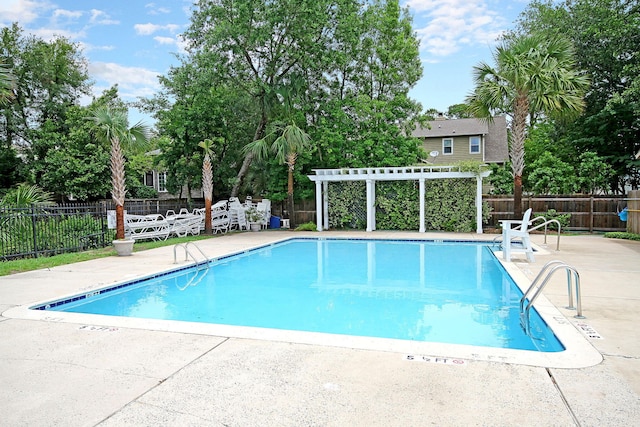community pool featuring a pergola, a fenced backyard, and a patio area