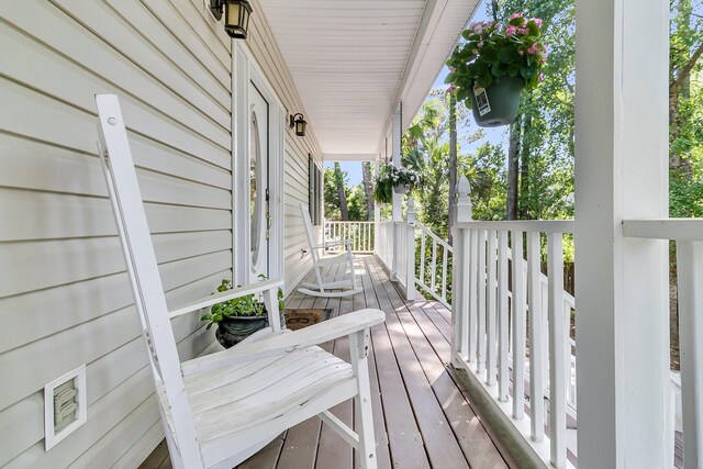 wooden terrace featuring a porch