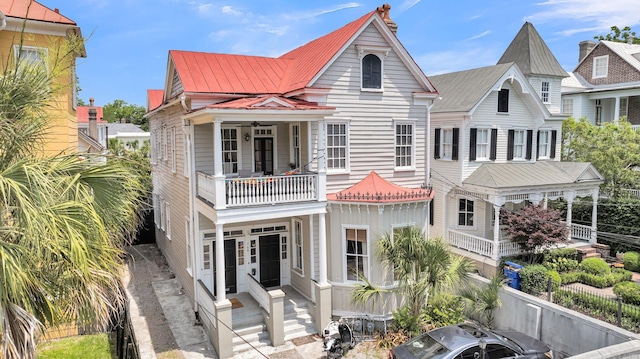 68 Vanderhorst St Unit A, Charleston, SC 29403 - view of front of property featuring a balcony, a metal roof, and entry steps