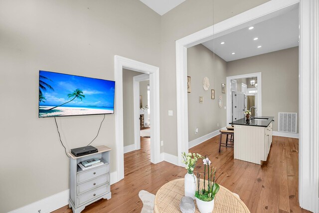 68 Vanderhorst St Unit A, Charleston, SC 29403 - living room with light wood finished floors and recessed lighting