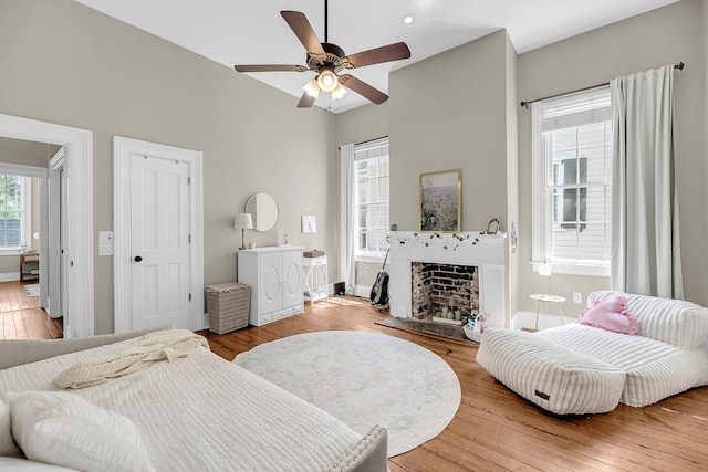 68 Vanderhorst St Unit A, Charleston, SC 29403 - bedroom featuring wood finished floors, a fireplace, and ceiling fan