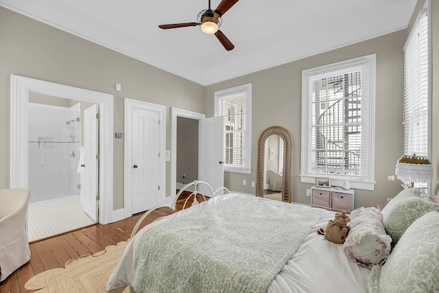 68 Vanderhorst St Unit A, Charleston, SC 29403 - bedroom featuring wood finished floors, ensuite bath, and ceiling fan