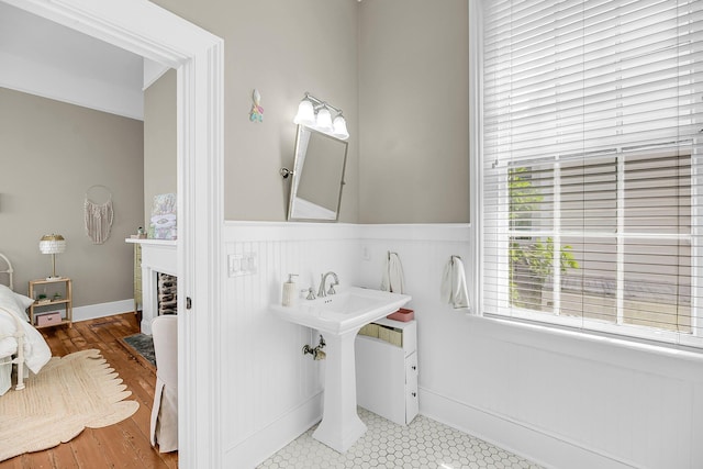 68 Vanderhorst St Unit A, Charleston, SC 29403 - bathroom featuring wainscoting and a fireplace