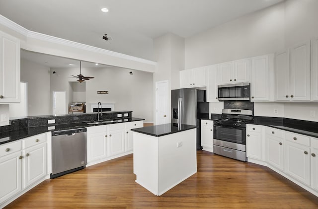 kitchen with white cabinetry, appliances with stainless steel finishes, and sink