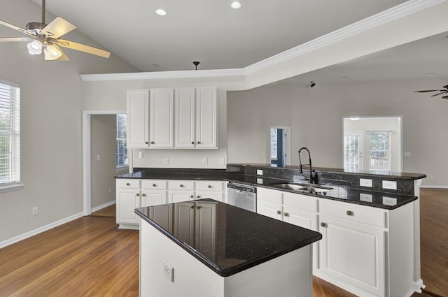 kitchen with dishwasher, sink, white cabinets, hardwood / wood-style flooring, and ceiling fan