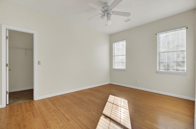 unfurnished room featuring ceiling fan and light wood-type flooring