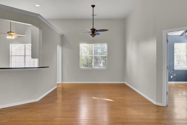 unfurnished living room featuring ceiling fan, a healthy amount of sunlight, and light hardwood / wood-style floors