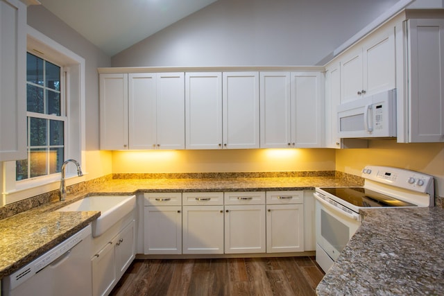 kitchen featuring a sink, dark wood-style floors, white cabinetry, white appliances, and lofted ceiling