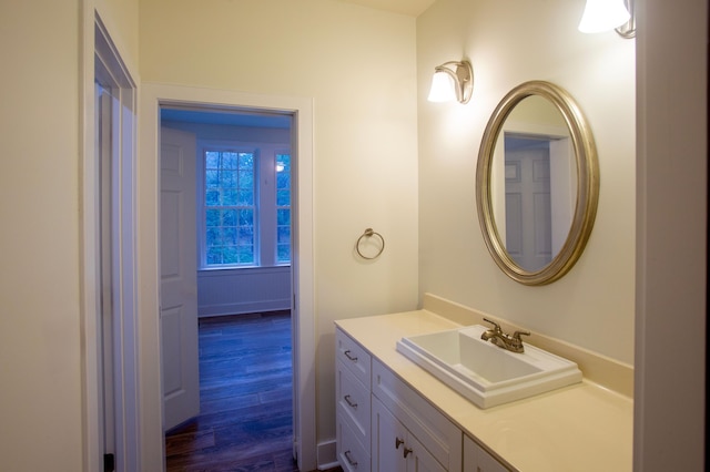 bathroom featuring vanity and wood finished floors