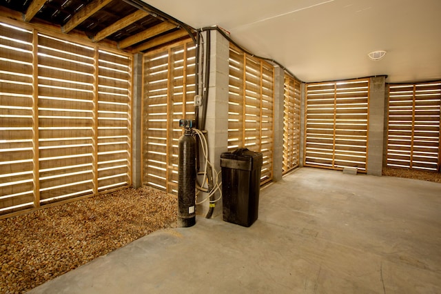 wine cellar featuring unfinished concrete flooring