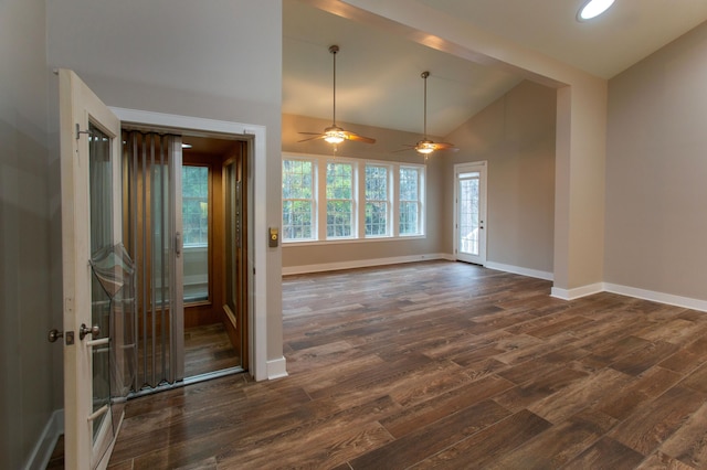 unfurnished room with dark wood finished floors, high vaulted ceiling, and baseboards