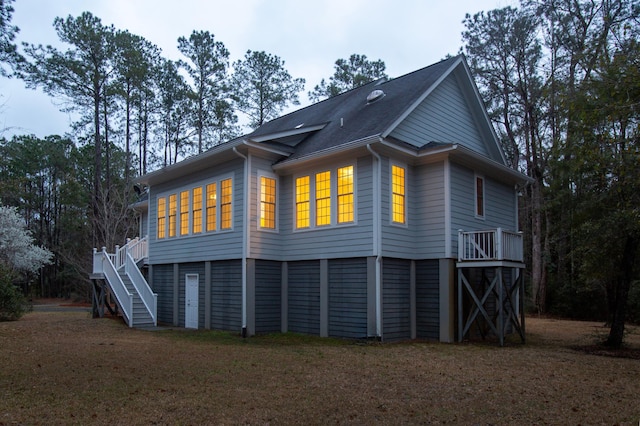 back of property with stairs